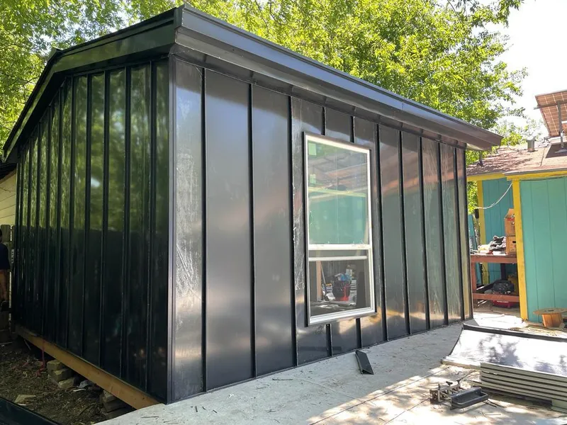 Black standing seam metal wall panels for Roof Inspection in Roosevelt